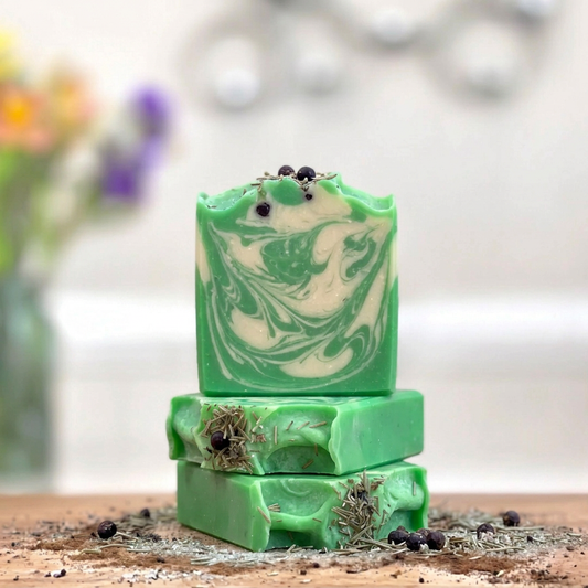 Three stacked Fir the Holidays soap bars with Kelly green and cream swirls