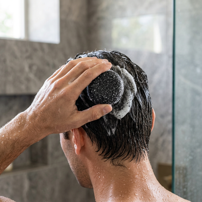Juniper Pine shampoo bar being used on wet hair